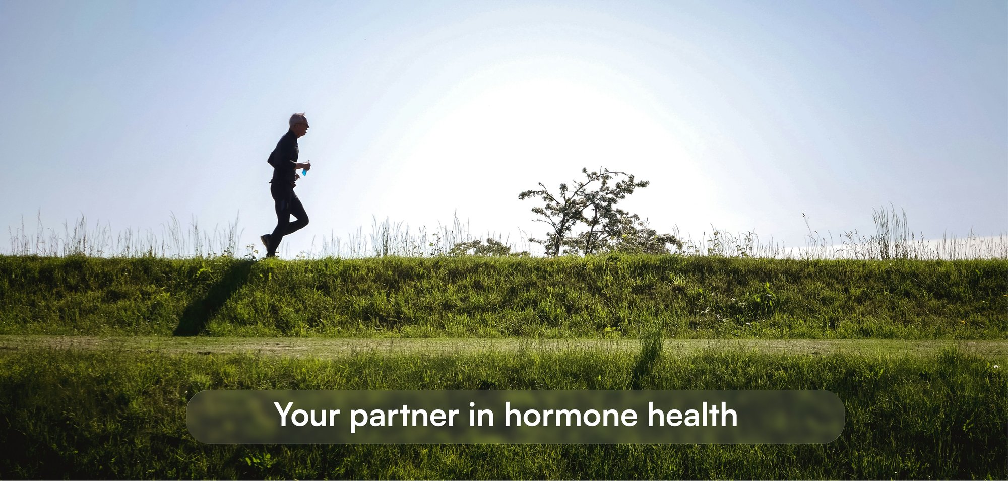 Early morning, man running through a field